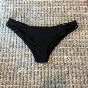 crossed black bikini bottoms